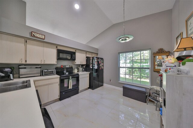 kitchen with cream cabinets, black appliances, sink, and high vaulted ceiling