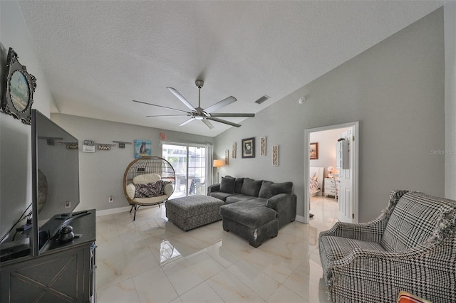 living room featuring a textured ceiling, ceiling fan, and vaulted ceiling