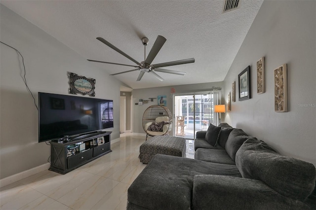 living room featuring a textured ceiling, ceiling fan, and lofted ceiling