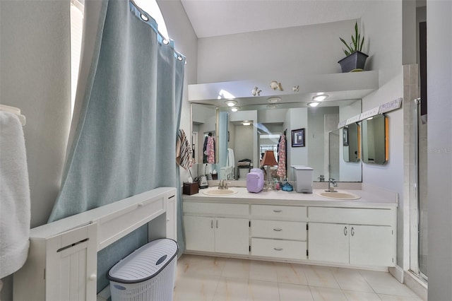 bathroom featuring an enclosed shower and vanity