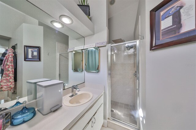 bathroom with vanity and an enclosed shower