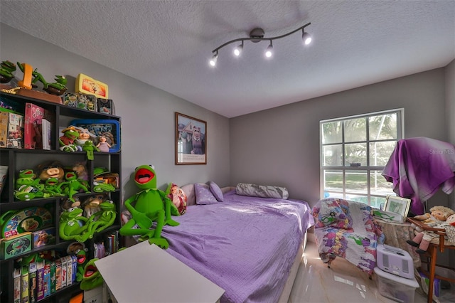 bedroom featuring a textured ceiling