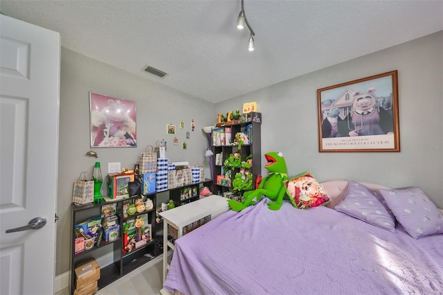 bedroom with a textured ceiling