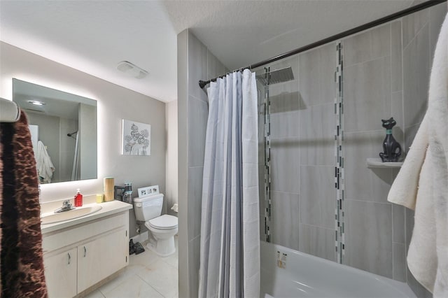 full bathroom featuring toilet, tile patterned flooring, vanity, a textured ceiling, and shower / bath combo with shower curtain