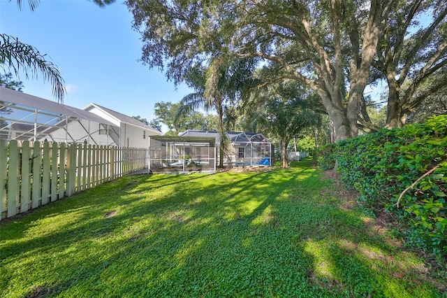 view of yard featuring a lanai