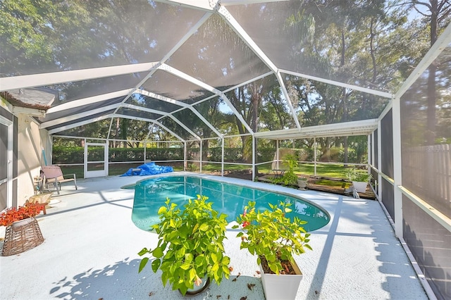 view of pool featuring a lanai and a patio area