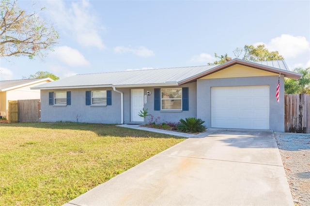 ranch-style house featuring a garage and a front lawn