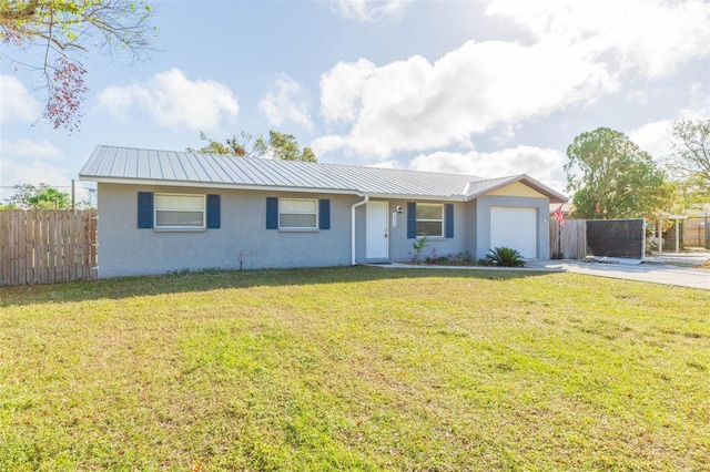 ranch-style home with a garage and a front lawn