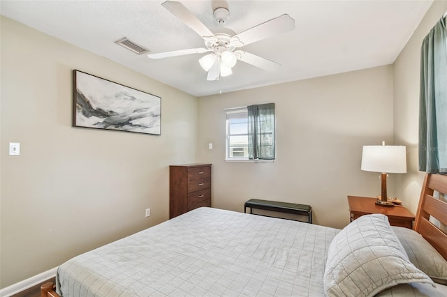 bedroom featuring ceiling fan and hardwood / wood-style floors