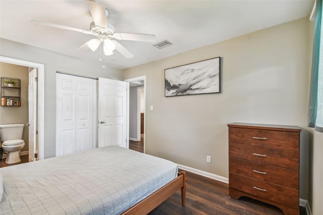 bedroom featuring a closet, dark hardwood / wood-style floors, ensuite bath, and ceiling fan