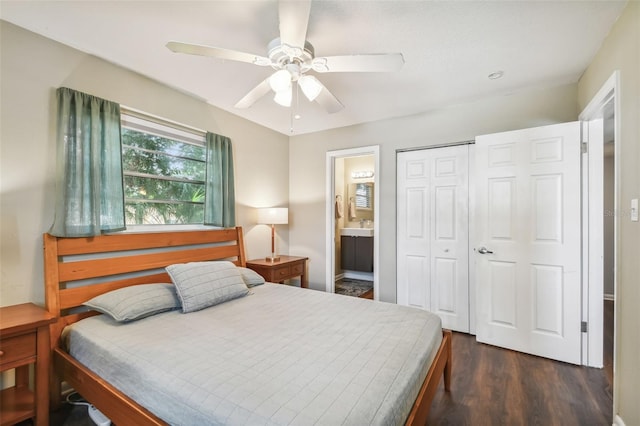 bedroom with a closet, dark hardwood / wood-style floors, connected bathroom, and ceiling fan