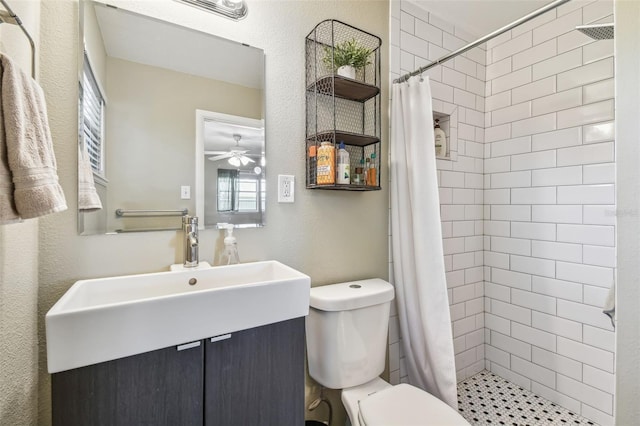 bathroom featuring toilet, vanity, and a shower with shower curtain