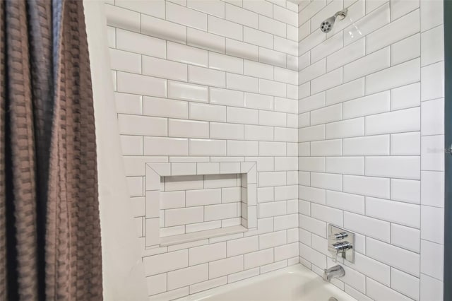 bathroom with shower / tub combo with curtain