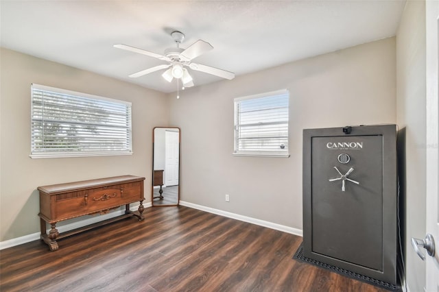 misc room with ceiling fan and dark hardwood / wood-style flooring