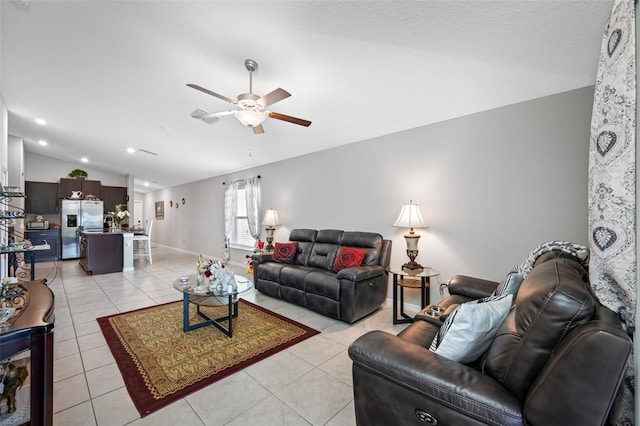 tiled living room featuring lofted ceiling and ceiling fan