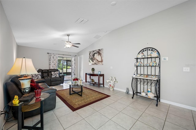 living room with lofted ceiling, light tile patterned flooring, and ceiling fan