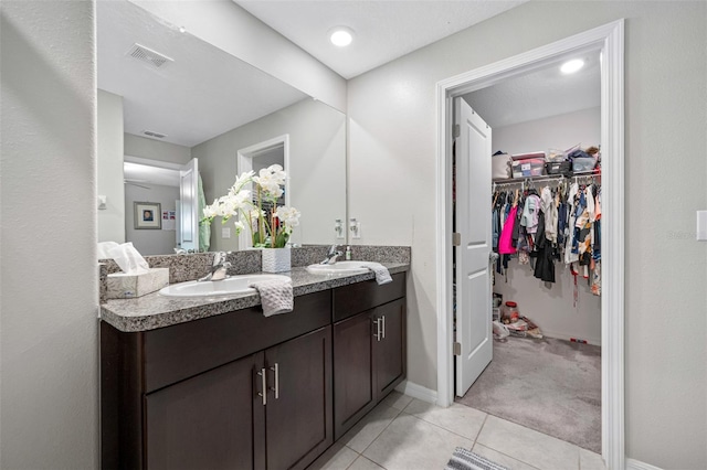 bathroom featuring tile patterned floors and vanity