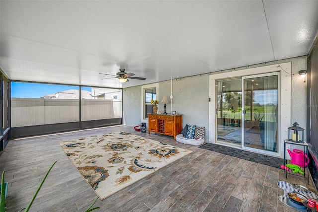 sunroom / solarium with ceiling fan and plenty of natural light