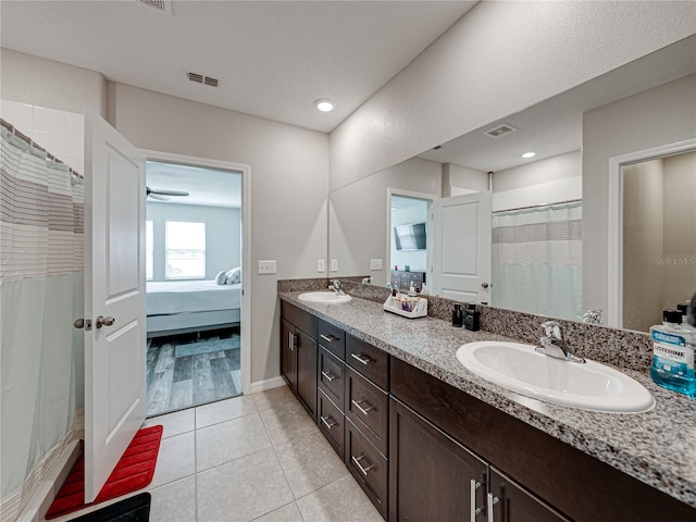 bathroom featuring tile patterned floors, a shower with shower curtain, and vanity