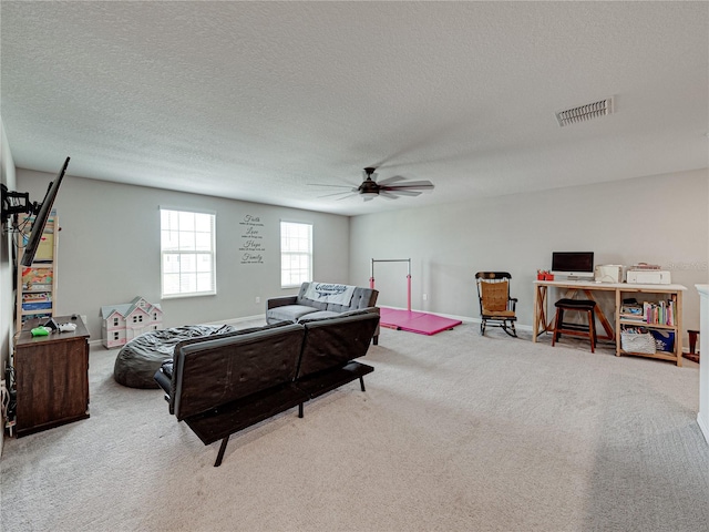 interior space featuring a textured ceiling and ceiling fan