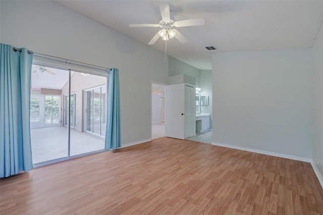 empty room featuring ceiling fan and light hardwood / wood-style floors