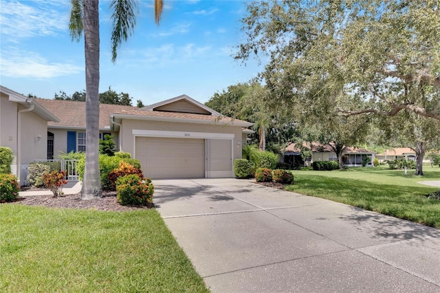 single story home featuring an attached garage, a front lawn, concrete driveway, and stucco siding