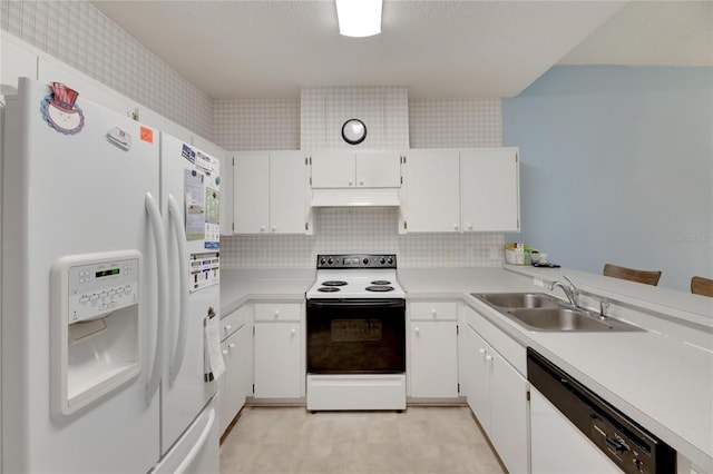 kitchen featuring white appliances, sink, white cabinets, and tasteful backsplash