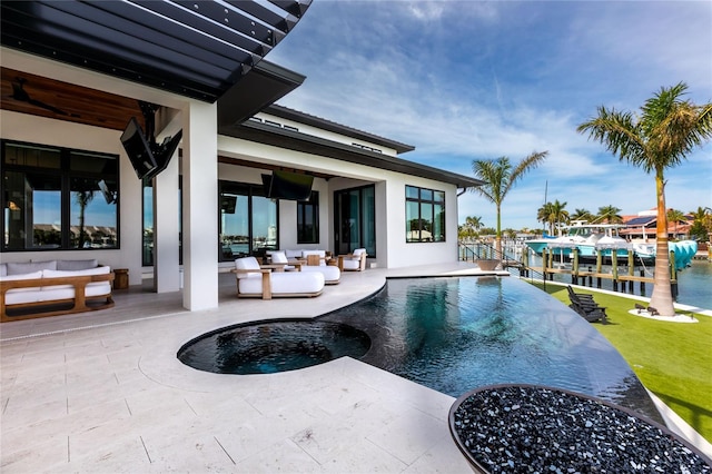 view of pool with a boat dock, a patio area, and outdoor lounge area