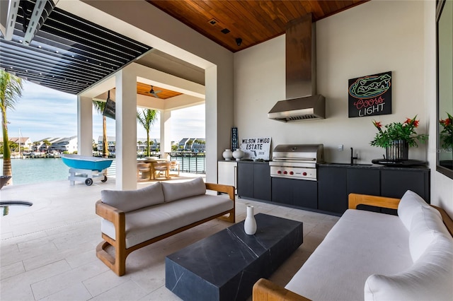 view of patio featuring outdoor lounge area, ceiling fan, and a water view