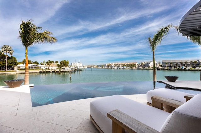 view of pool featuring a water view