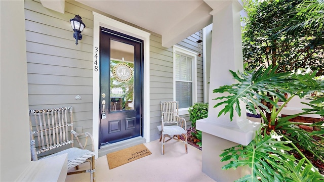 property entrance featuring a porch