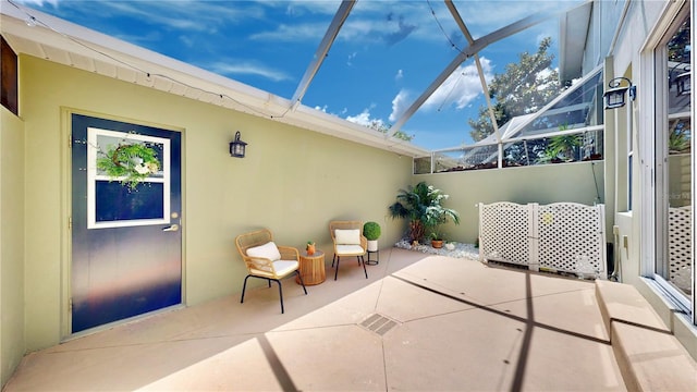 view of patio / terrace featuring a lanai