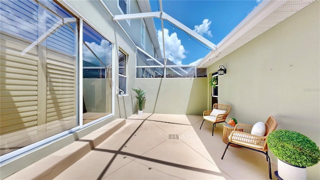 view of patio / terrace with a lanai