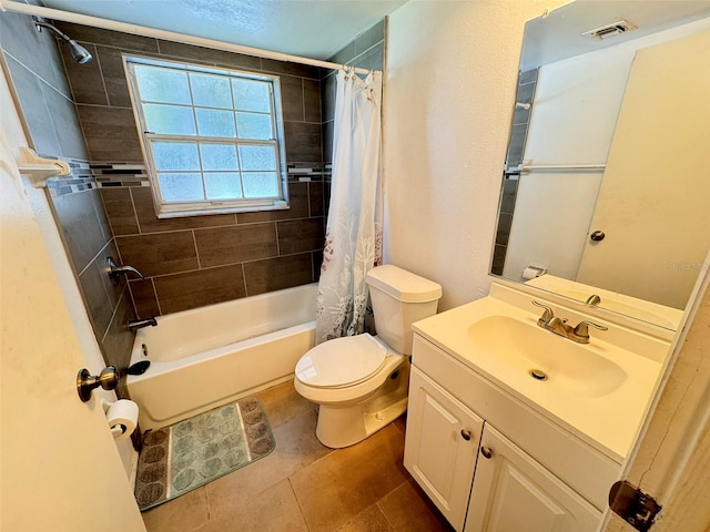 full bathroom with shower / bath combo with shower curtain, tile patterned flooring, toilet, and vanity