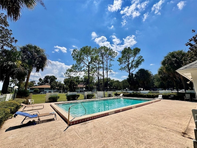 view of swimming pool with a patio