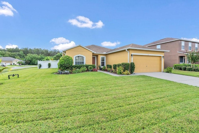 view of front of house with a garage and a front lawn