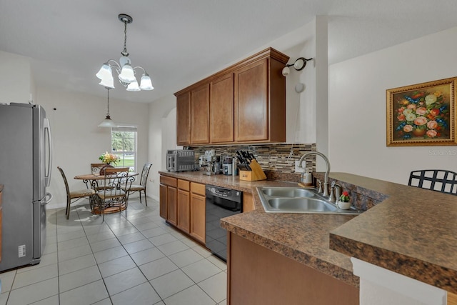 kitchen featuring an inviting chandelier, black dishwasher, light tile patterned floors, stainless steel refrigerator, and sink