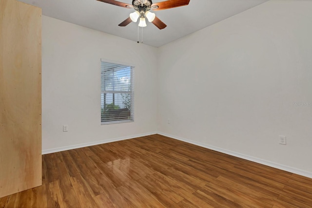 spare room with hardwood / wood-style flooring and ceiling fan