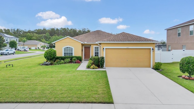 view of front facade with a front lawn and a garage