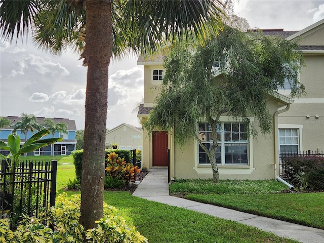 view of front of property with a front lawn