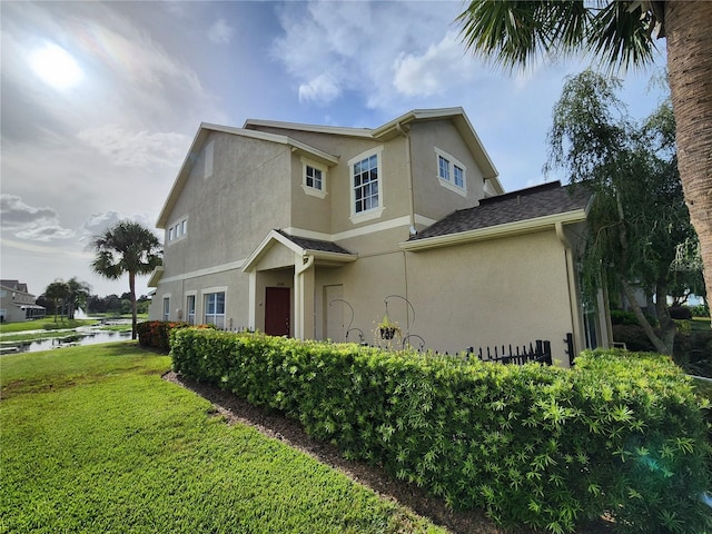 view of home's exterior featuring a lawn