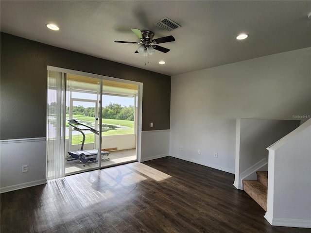 unfurnished room with dark wood-type flooring and ceiling fan