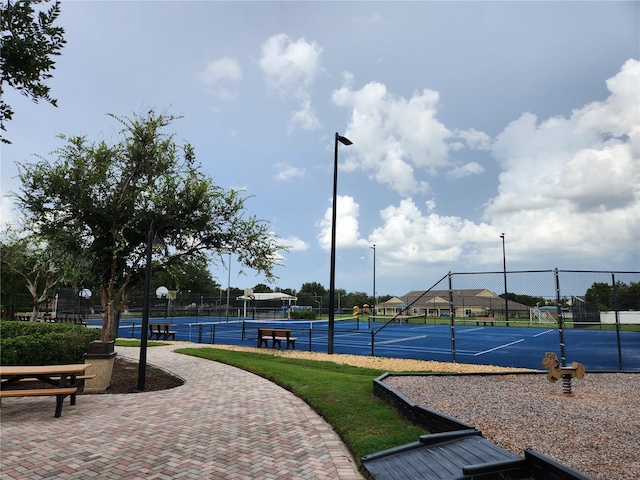 view of community with tennis court