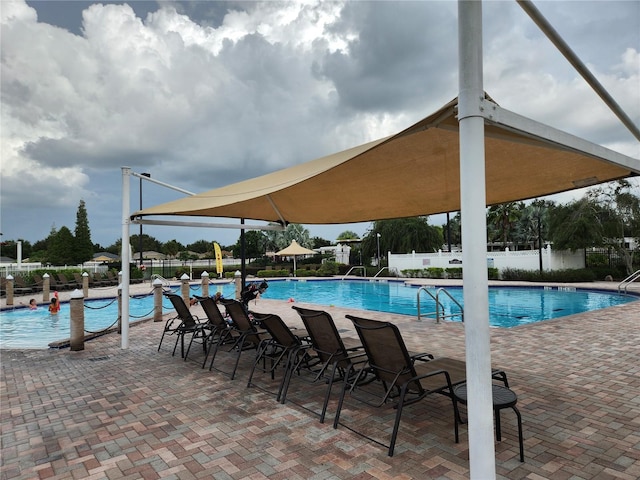 view of swimming pool featuring a patio area