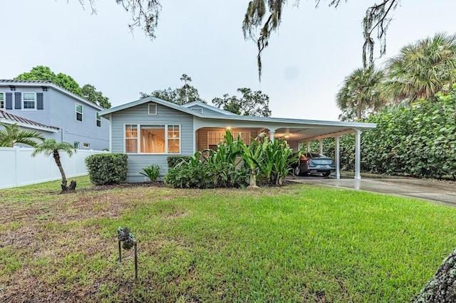 view of front of house featuring a front yard and a carport