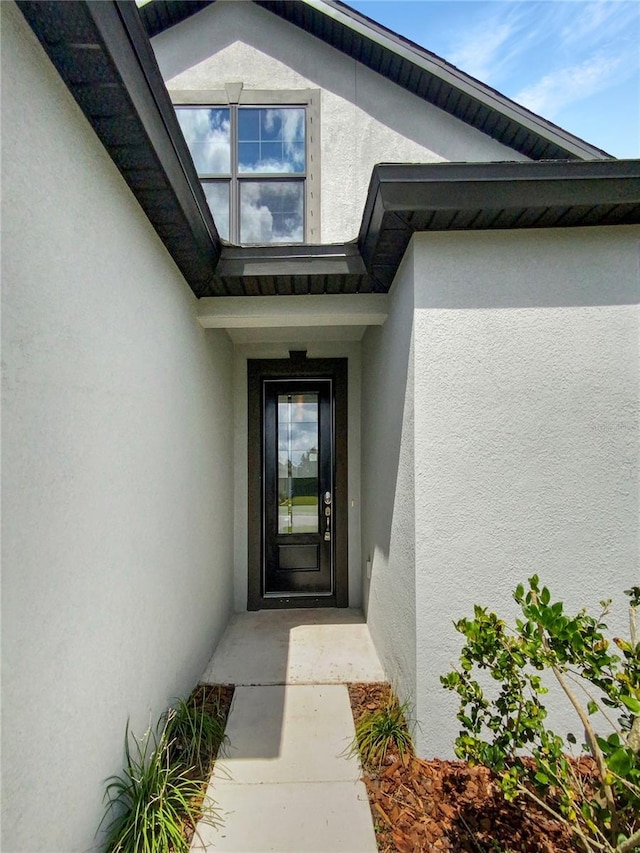 13292 Sea Bridge Dr, Hudson, FL 34669 - view of exterior entry featuring stucco siding