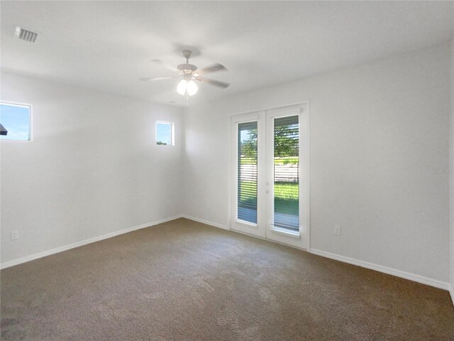 13292 Sea Bridge Dr, Hudson, FL 34669 - carpeted empty room with baseboards, visible vents, and a ceiling fan
