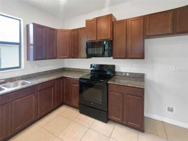 kitchen with black appliances, light tile patterned flooring, and sink