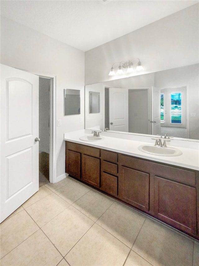 13292 Sea Bridge Dr, Hudson, FL 34669 - bathroom with tile patterned flooring, a sink, and double vanity