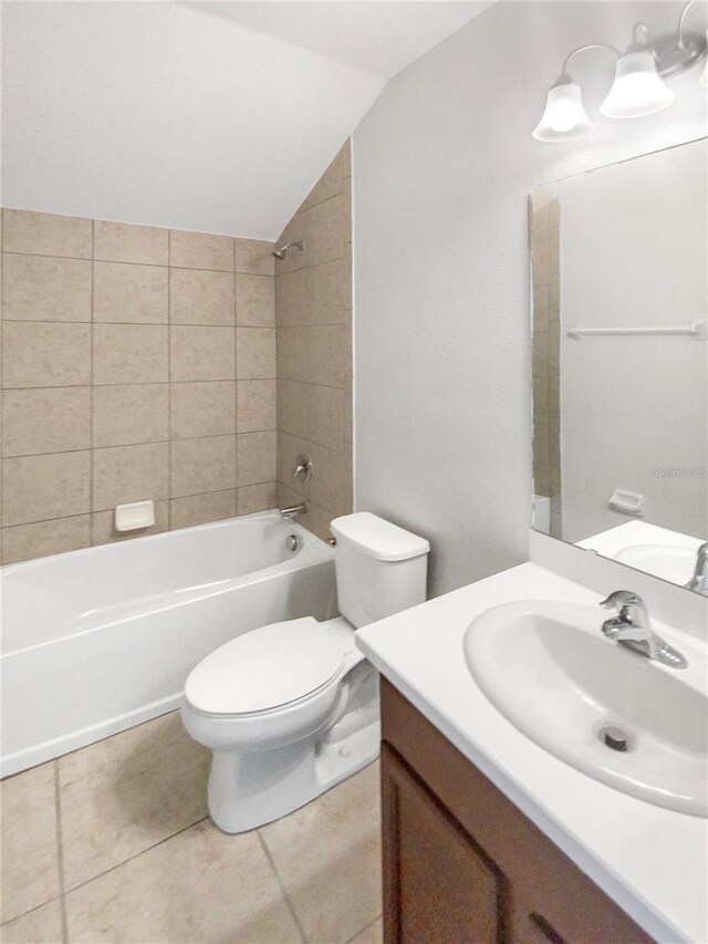 13292 Sea Bridge Dr, Hudson, FL 34669 - full bath featuring tile patterned flooring, vanity, lofted ceiling, toilet, and bathing tub / shower combination